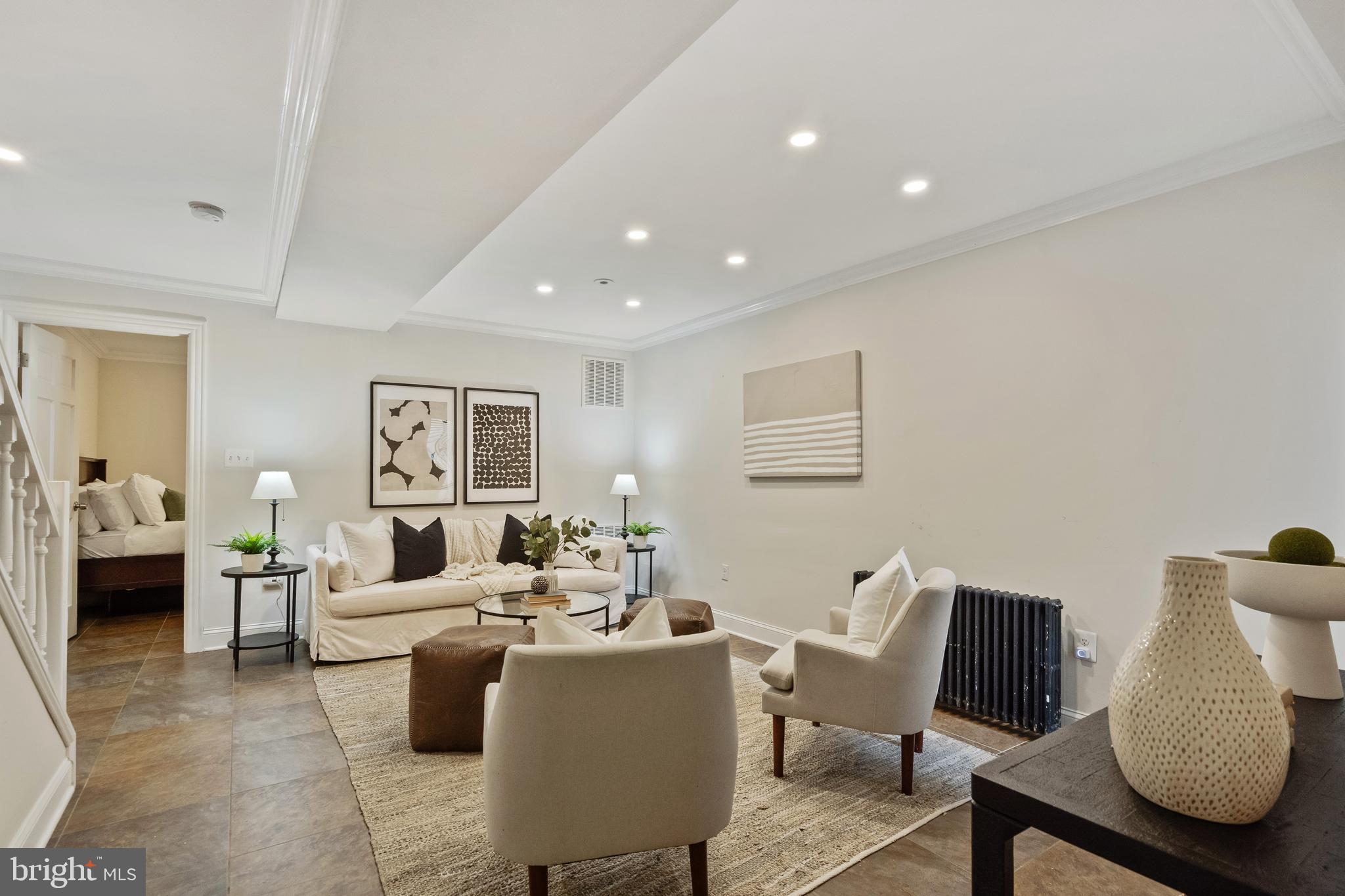 705 7th Street Northeast Washington, DC 20002 - Photo 34 of 48 a living room with couches and a potted plant on table
