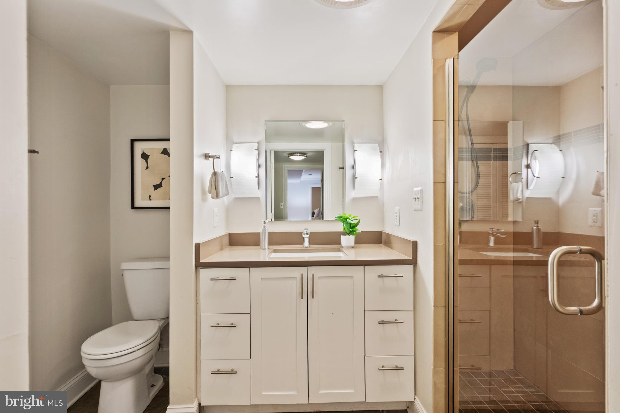 705 7th Street Northeast Washington, DC 20002 - Photo 37 of 48 a bathroom with a granite countertop sink toilet and shower