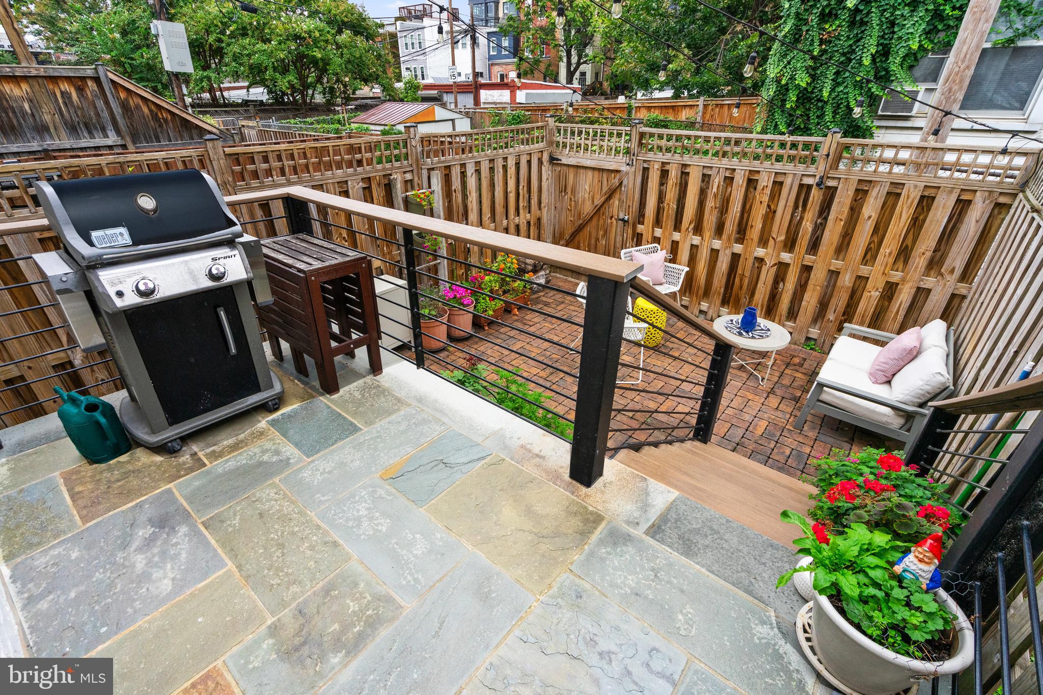 705 7th Street Northeast Washington, DC 20002 - Photo 41 of 48 a view of a balcony with wooden floor outdoor seating and yard in the back