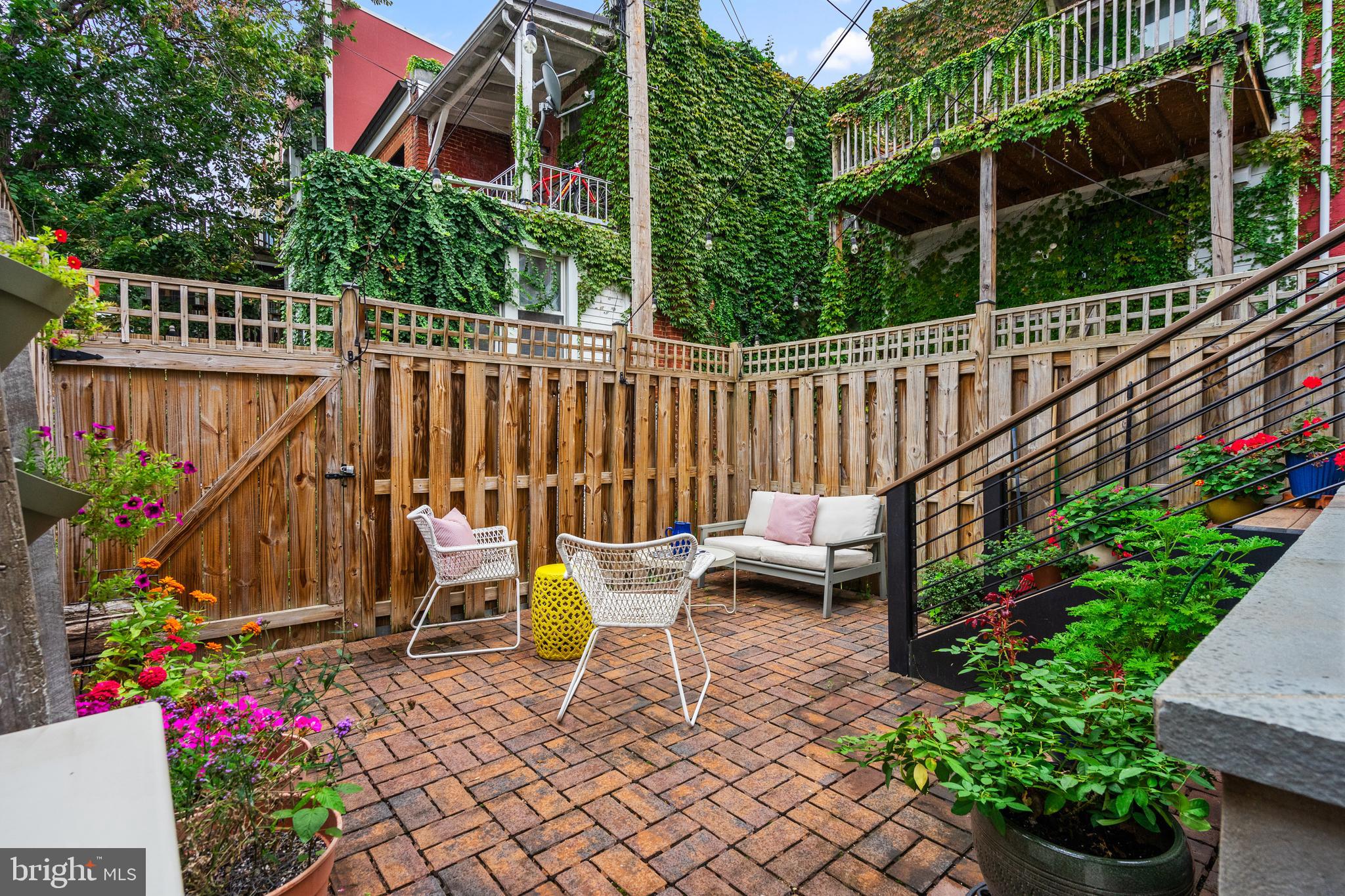 705 7th Street Northeast Washington, DC 20002 - Photo 42 of 48 a view of a chairs and table in the backyard