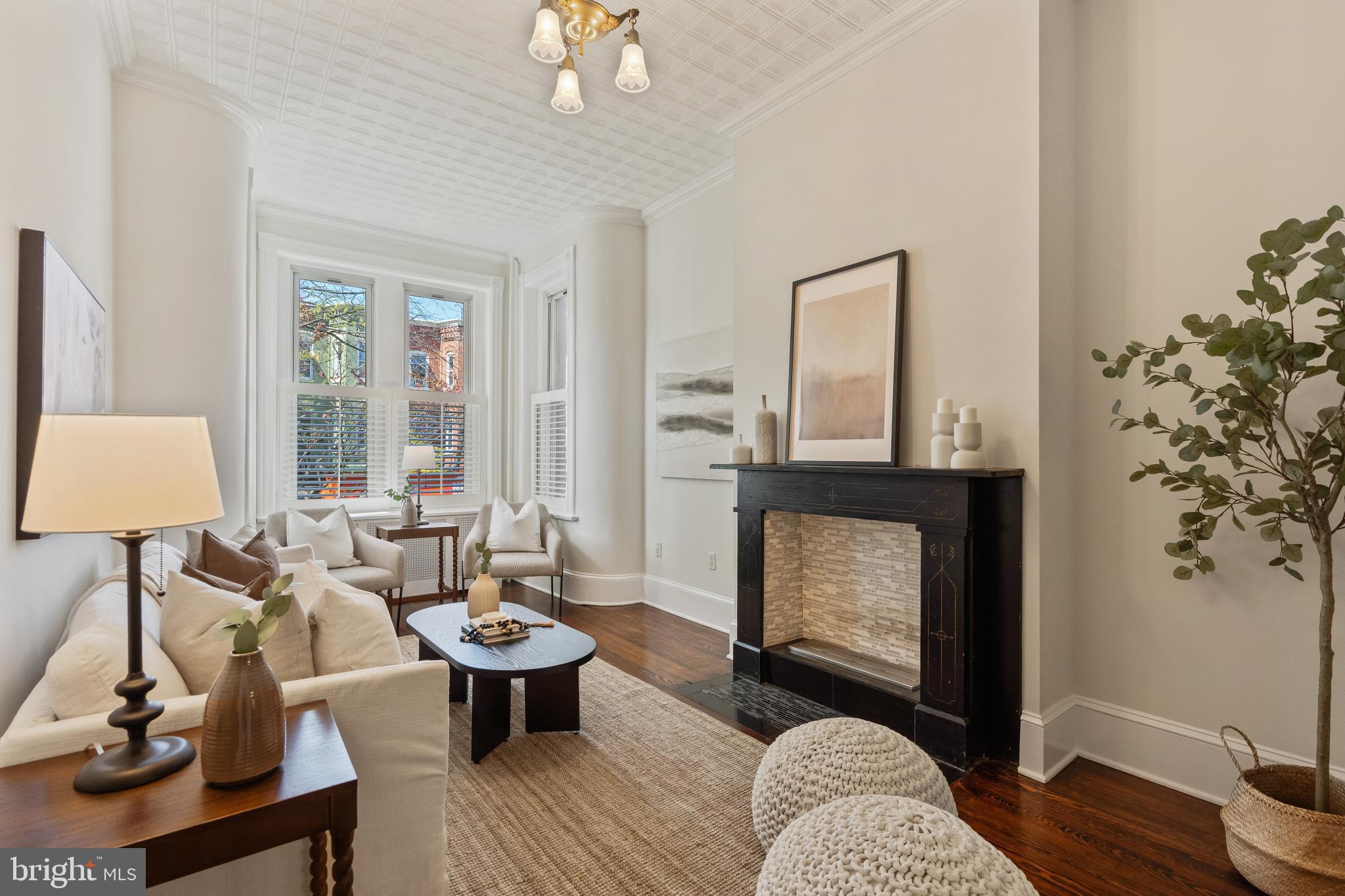 705 7th Street Northeast Washington, DC 20002 - Photo 5 of 48 a living room with furniture and a fireplace