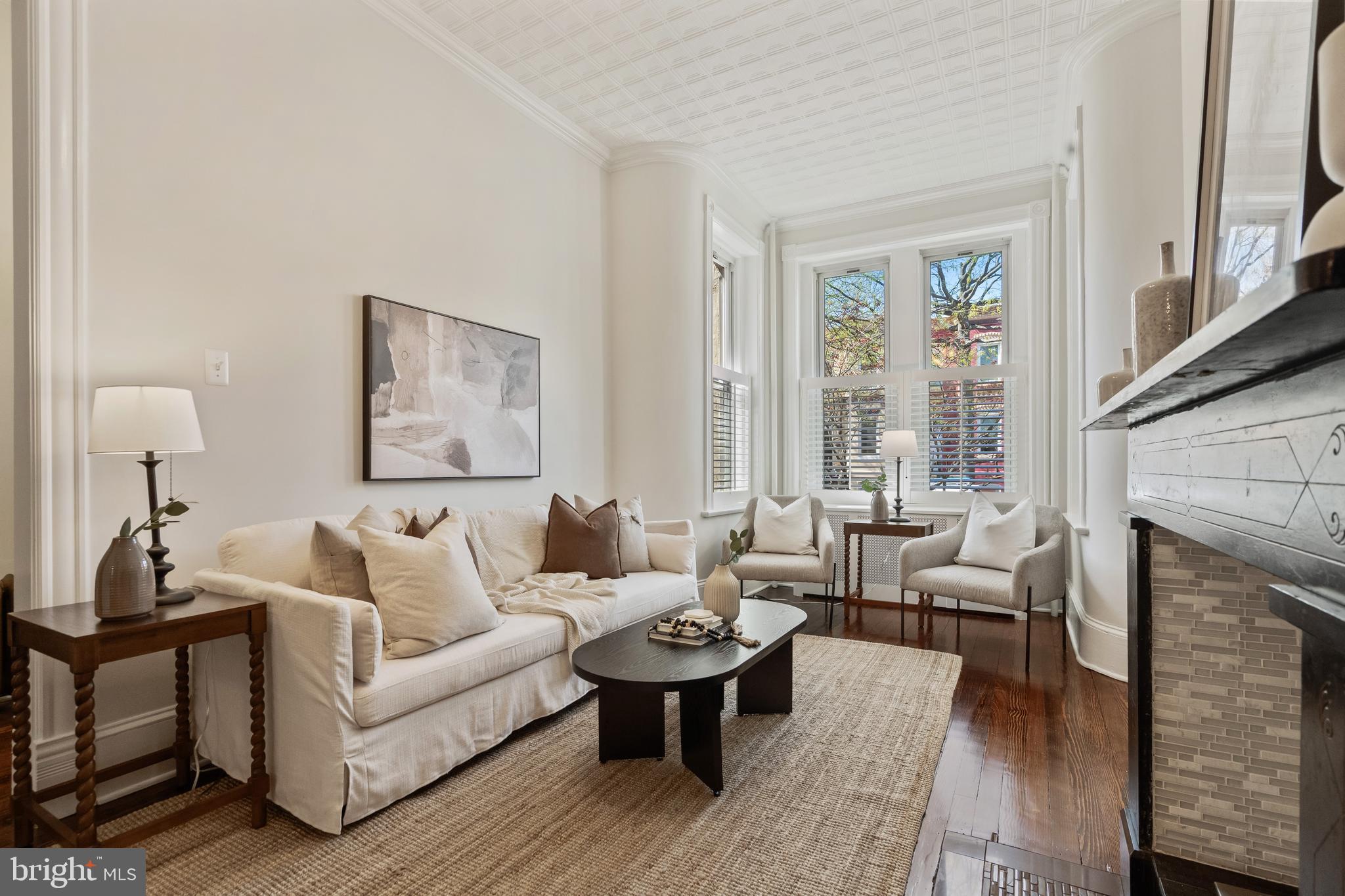 705 7th Street Northeast Washington, DC 20002 - Photo 7 of 48 a living room with furniture and a fireplace