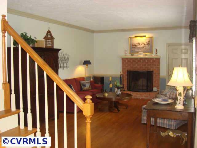 2625 Salisbury Road Midlothian, VA 23113 - Photo 3 of 6 a living room with furniture and a fireplace