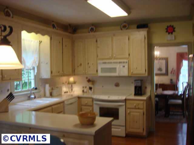 2625 Salisbury Road Midlothian, VA 23113 - Photo 6 of 6 a kitchen with a sink cabinets and window