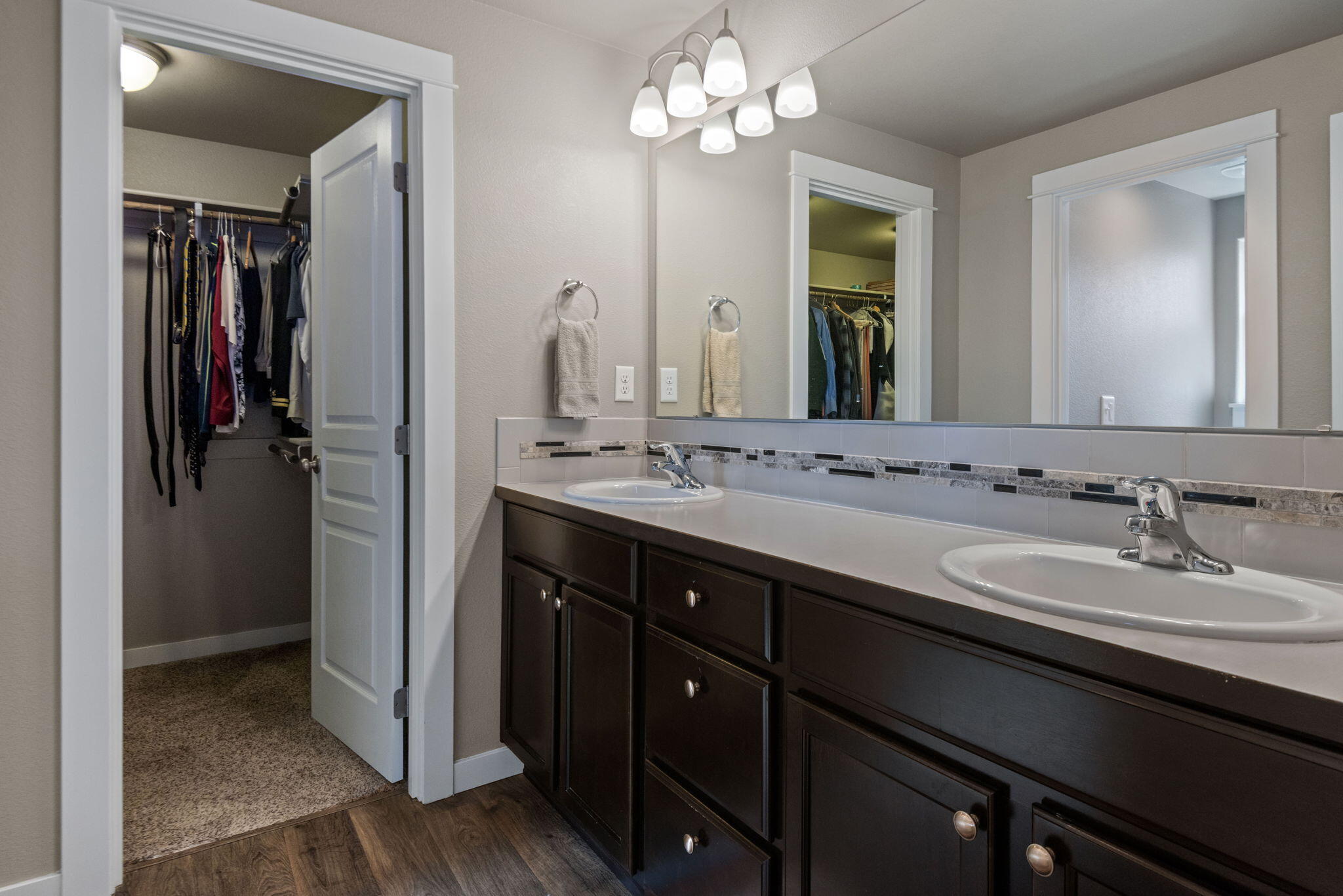 715 Brooks Camp Road Sisters, OR 97759 - Photo 15 of 25 a bathroom with a double vanity sink and a mirror