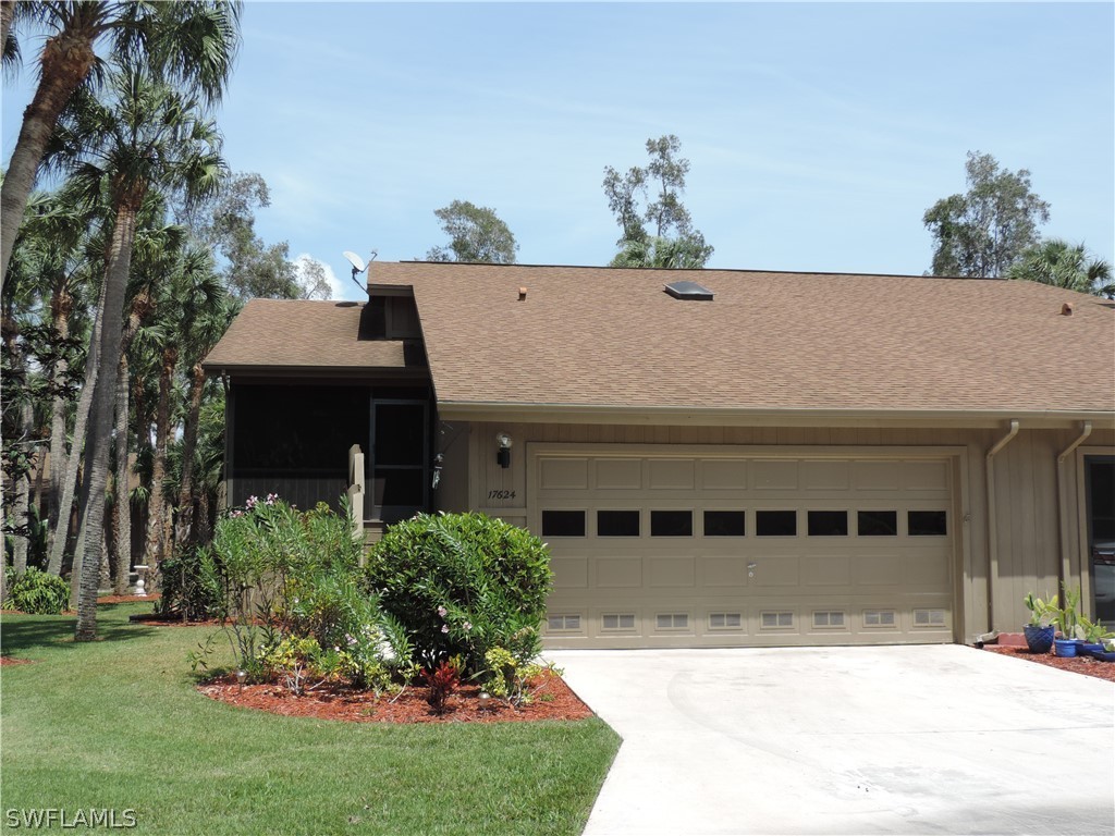 17624 Village Inlet Court Fort Myers, FL 33908 - Photo 1 of 17 a front view of a house with a yard