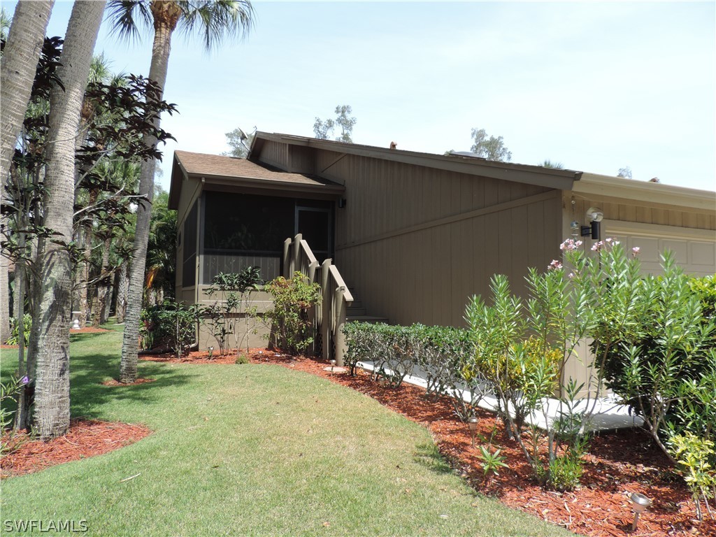 17624 Village Inlet Court Fort Myers, FL 33908 - Photo 2 of 17 a front view of a house with a yard