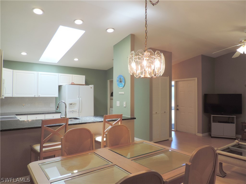 17624 Village Inlet Court Fort Myers, FL 33908 - Photo 7 of 17 a room with table chairs workspace and a mirror