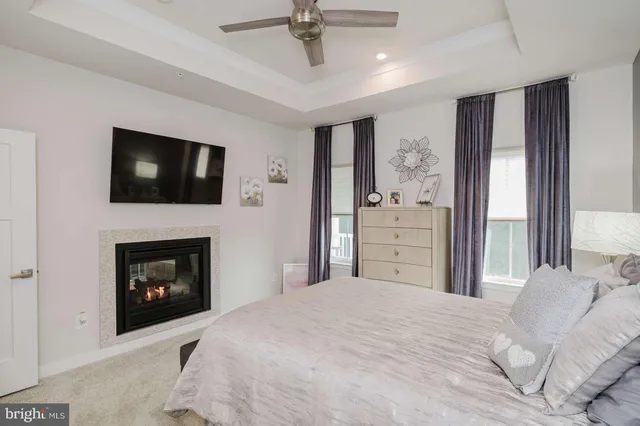 a bedroom with a bed and a fireplace