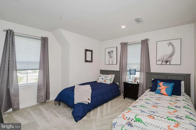 a bedroom with double bed and a window