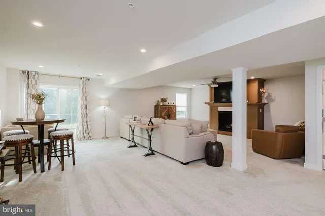 a living room with furniture and a table