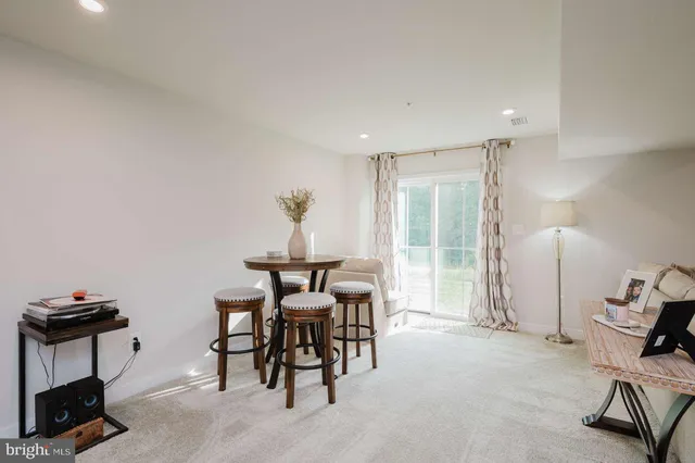 a view of a livingroom with furniture and a window