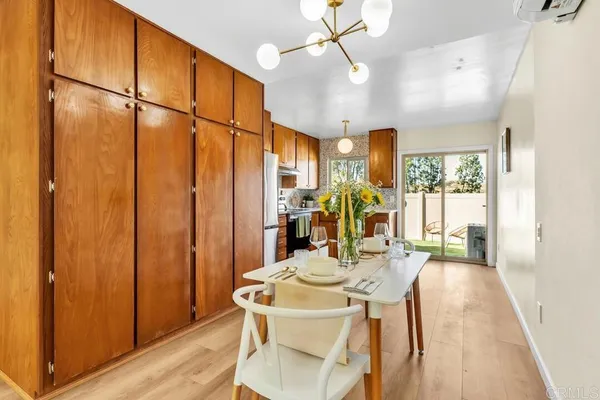 a view of a dining room with furniture window and wooden floor