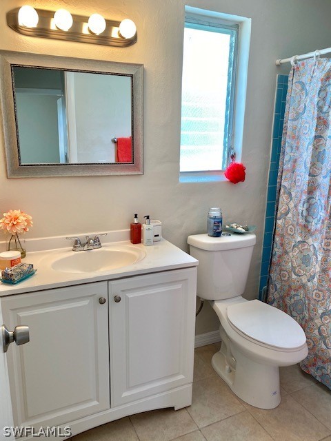 306 Oregon Road West Lehigh Acres, FL 33936 - Photo 12 of 26 a bathroom with a sink toilet and mirror