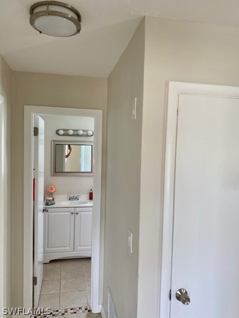 306 Oregon Road West Lehigh Acres, FL 33936 - Photo 13 of 26 a view of kitchen with white wooden cabinets