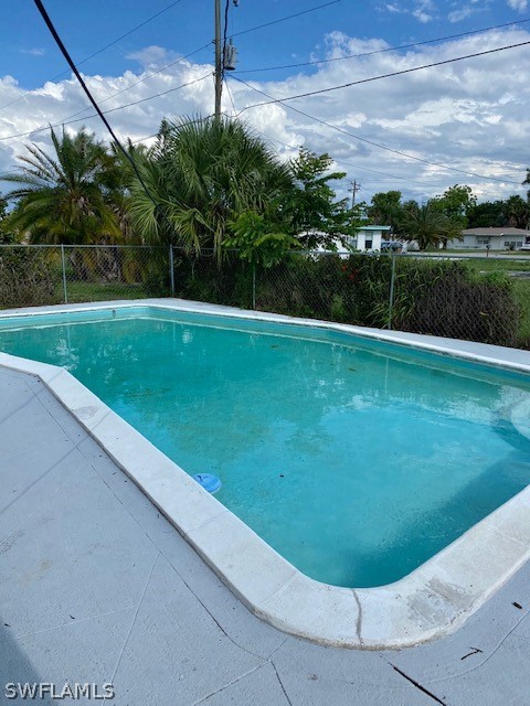 306 Oregon Road West Lehigh Acres, FL 33936 - Photo 16 of 26 a view of a backyard with a garden