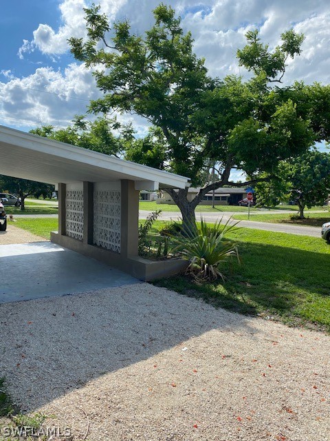 306 Oregon Road West Lehigh Acres, FL 33936 - Photo 17 of 26 a view of a backyard