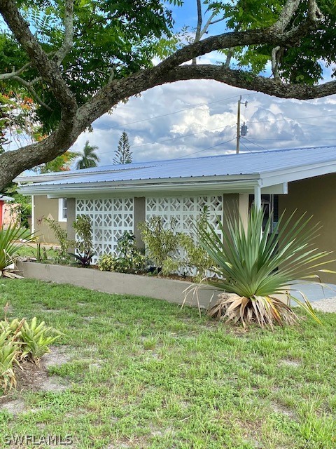 306 Oregon Road West Lehigh Acres, FL 33936 - Photo 22 of 26 a view of a backyard of a house