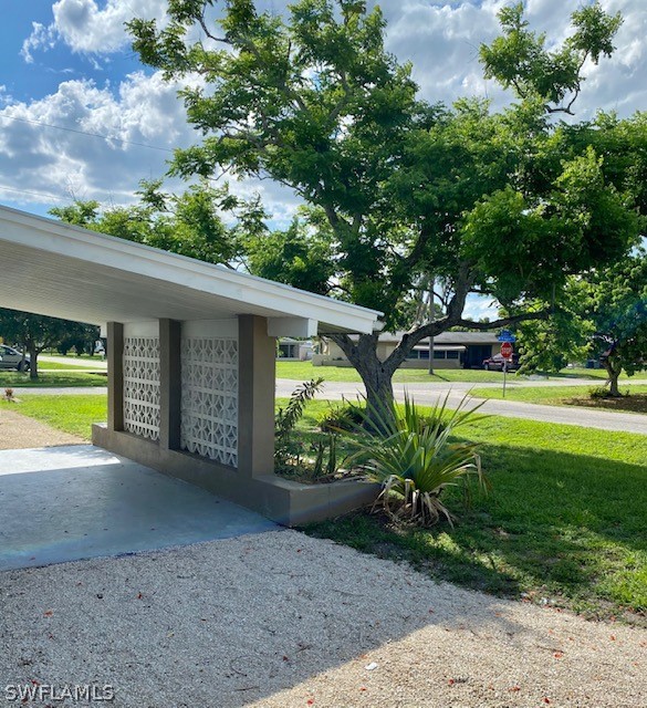 306 Oregon Road West Lehigh Acres, FL 33936 - Photo 4 of 26 a view of a house with a swimming pool