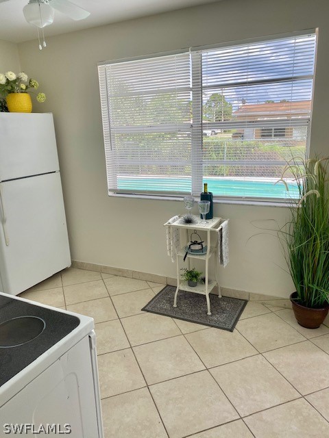 306 Oregon Road West Lehigh Acres, FL 33936 - Photo 7 of 26 a table and chair in a kitchen