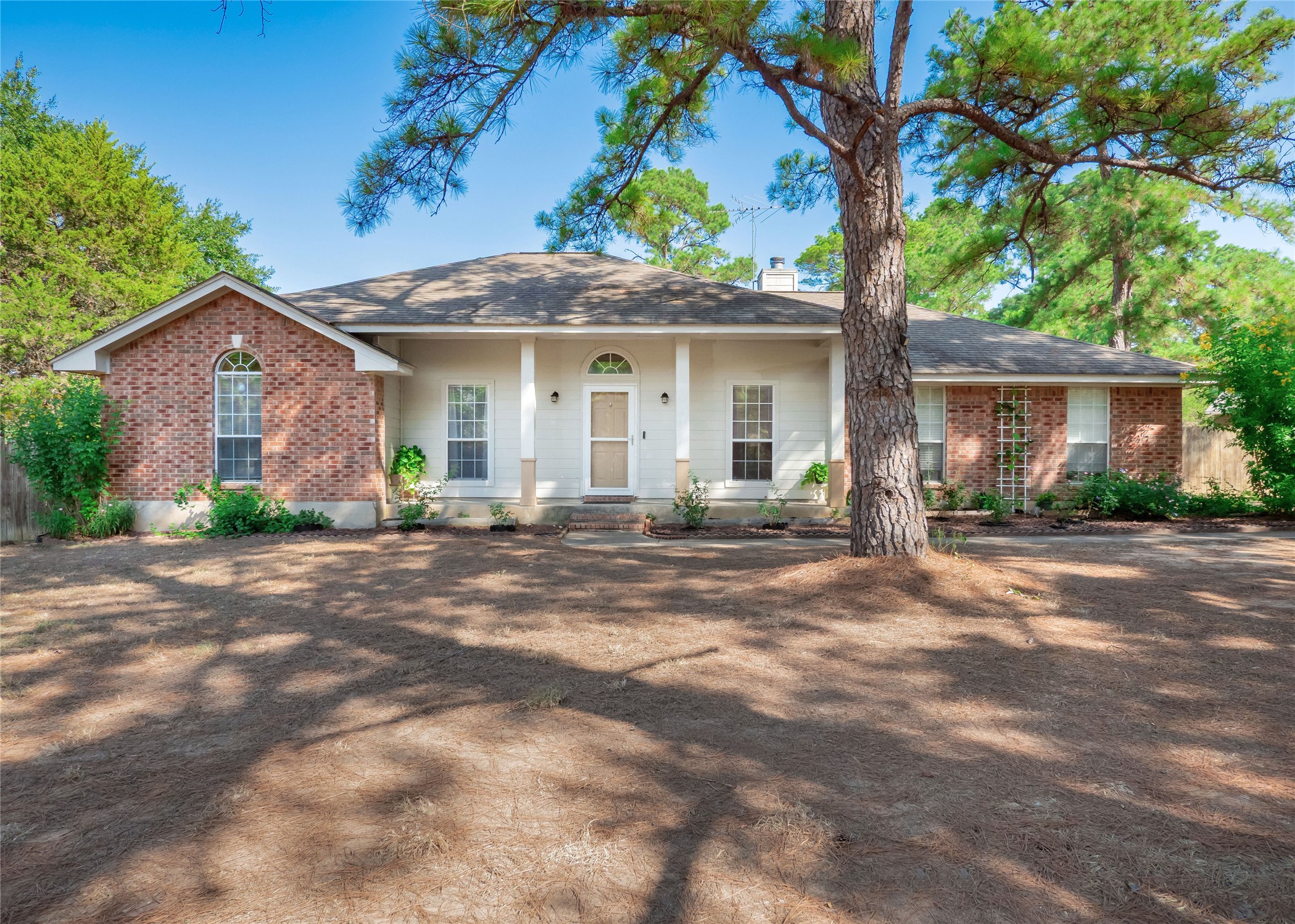 front view of a house with a garden