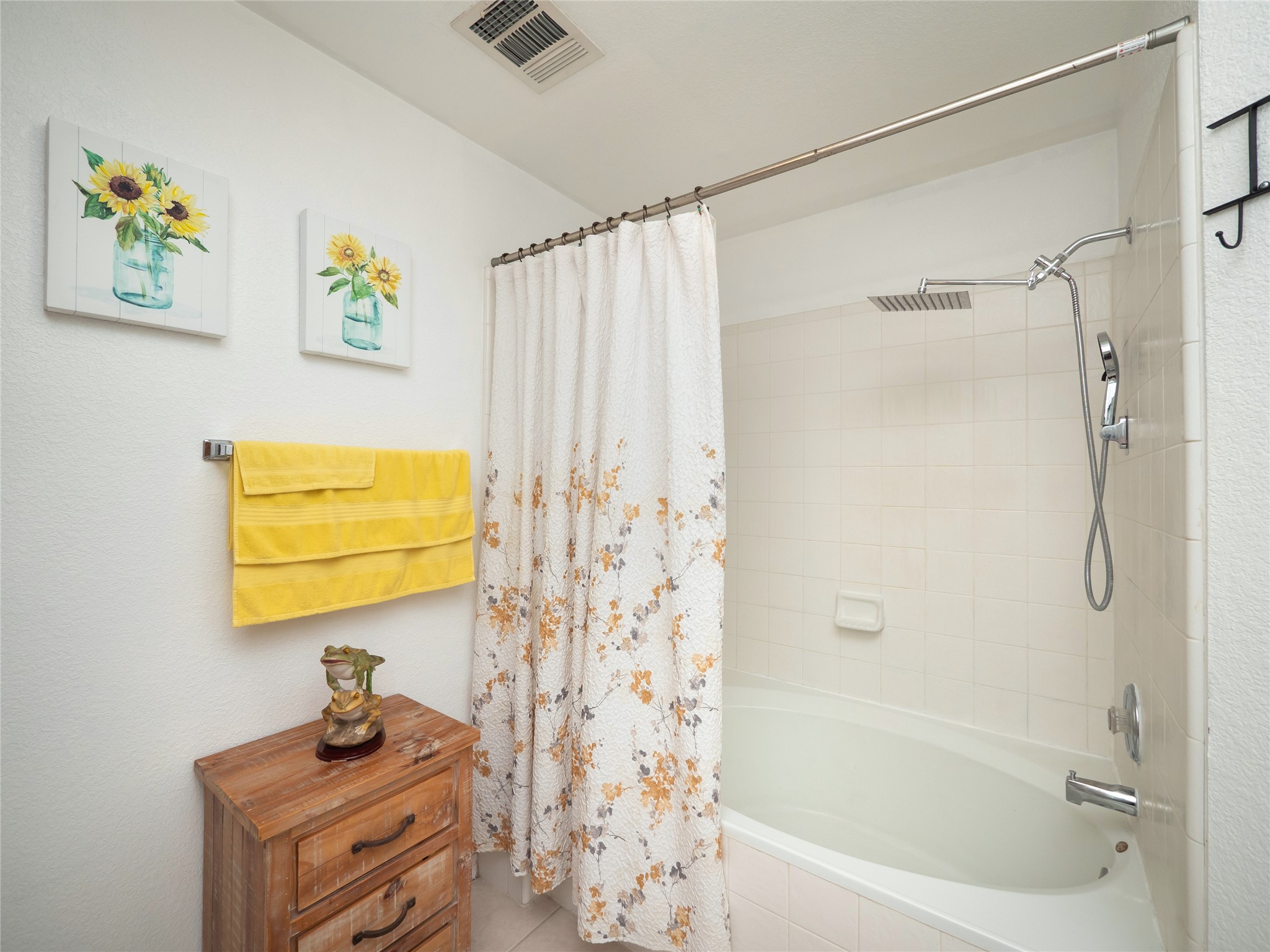 228 Old Firetower Road Bastrop, TX 78602 - Photo 18 of 40 a bathroom with a shower curtain and a bathtub