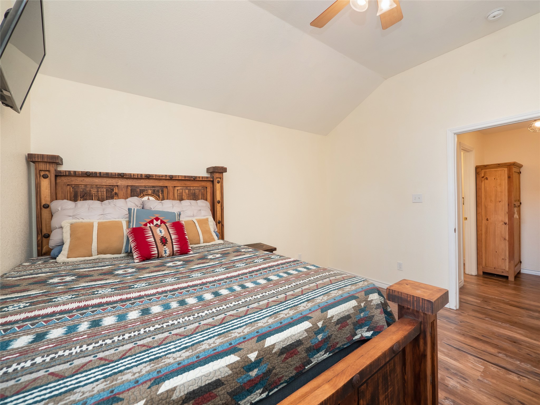 228 Old Firetower Road Bastrop, TX 78602 - Photo 22 of 40 a bedroom with a bed and wooden floor