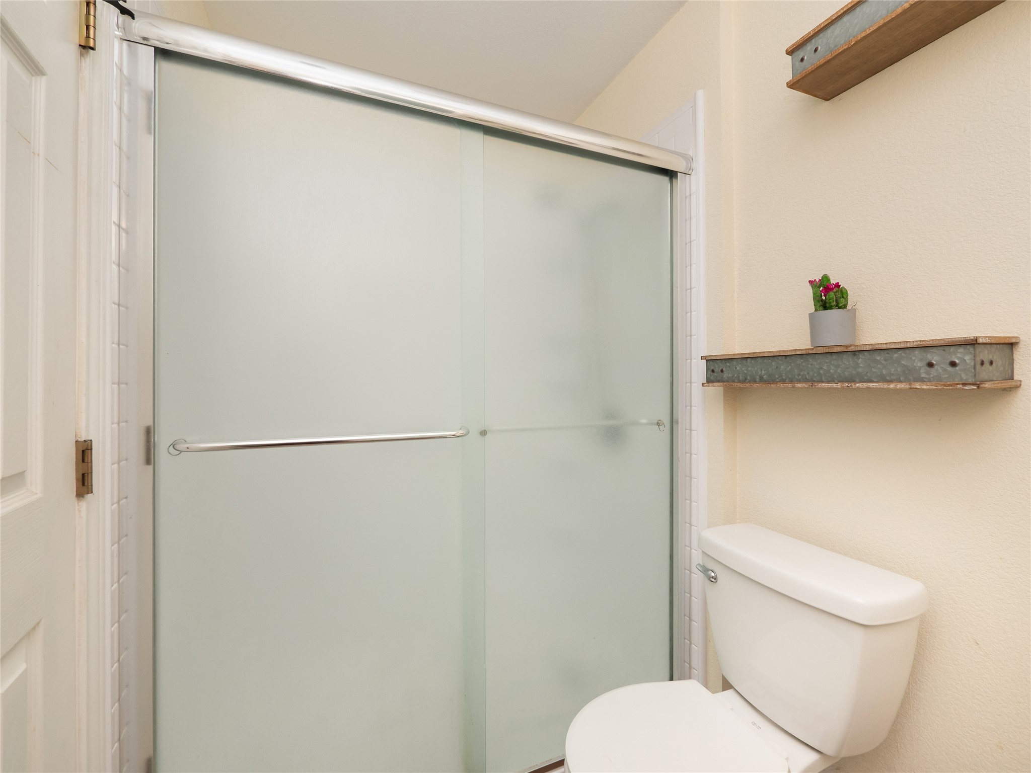 228 Old Firetower Road Bastrop, TX 78602 - Photo 24 of 40 a white toilet sitting next to a shower