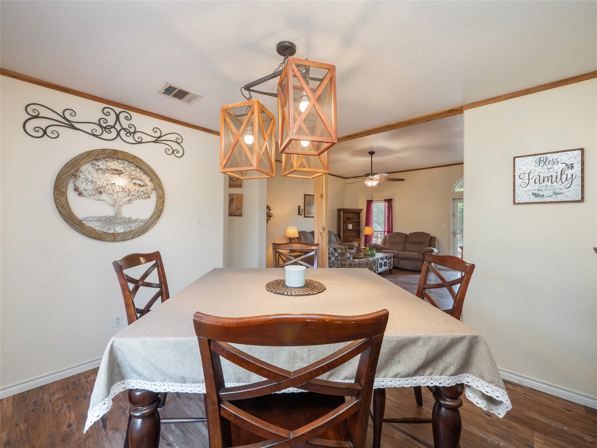 228 Old Firetower Road Bastrop, TX 78602 - Photo 8 of 40 a view of a dining room with furniture and a chandelier