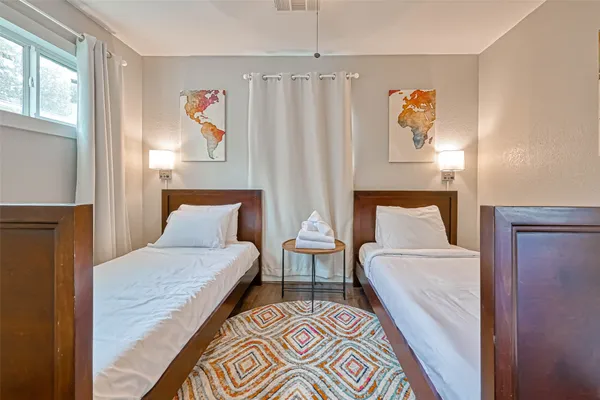 a bedroom with furniture and a window