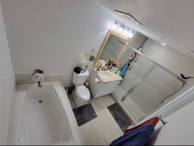 a view of living room with furniture and a chandelier