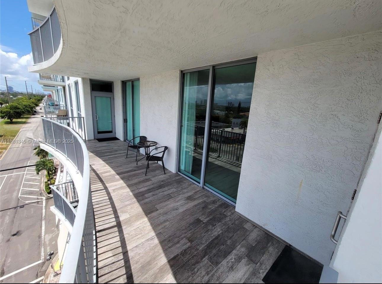 140 South Dixie Highway, Unit 519 Hollywood, FL 33020 - Photo 20 of 28 a view of a hallway with wooden floor and staircase