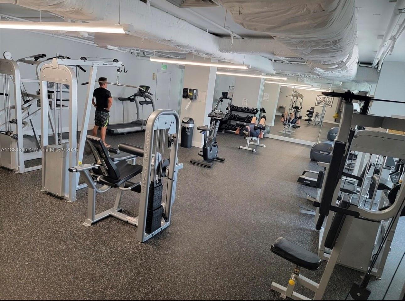 140 South Dixie Highway, Unit 519 Hollywood, FL 33020 - Photo 25 of 28 a view of a room with gym equipment