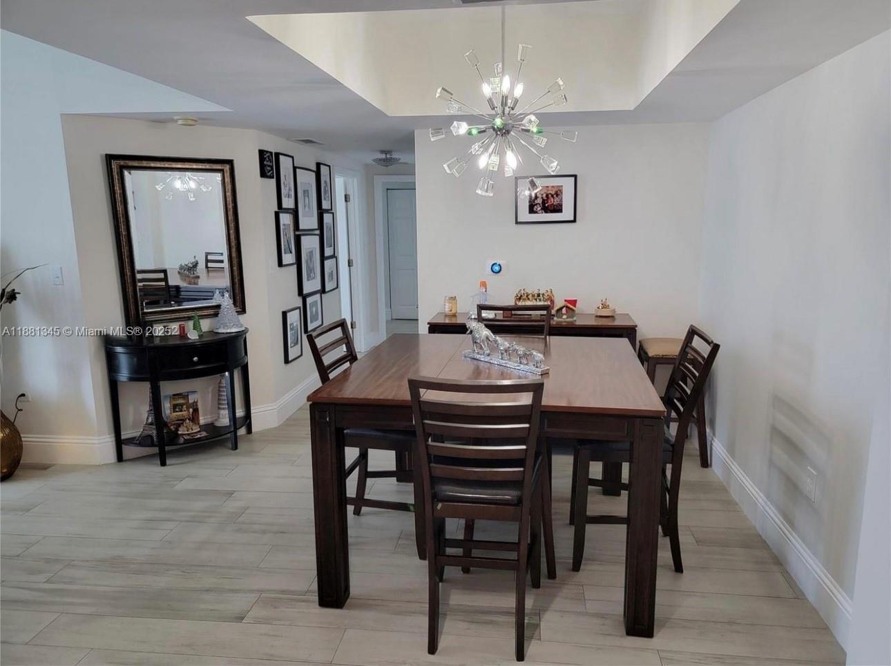 140 South Dixie Highway, Unit 519 Hollywood, FL 33020 - Photo 4 of 28 a view of a dining room with furniture and wooden floor