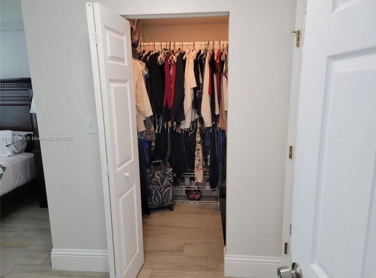 140 South Dixie Highway, Unit 519 Hollywood, FL 33020 - Photo 10 of 28 a view of walk in closet with clothes and shoes