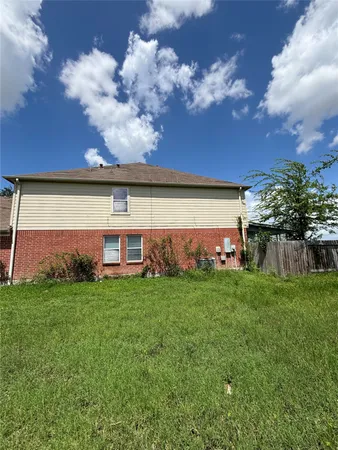a view of a house with a big yard
