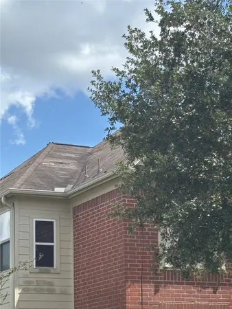 a view of a house with a tree