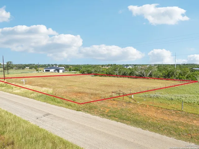 a view of a swimming pool and an outdoor seating