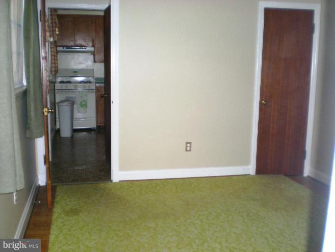 222 Ridgeway Road Catonsville, MD 21228 - Photo 8 of 14 Freshly painted room with H/W floors