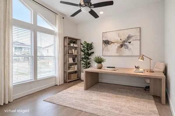 a view of a room with a window and furniture