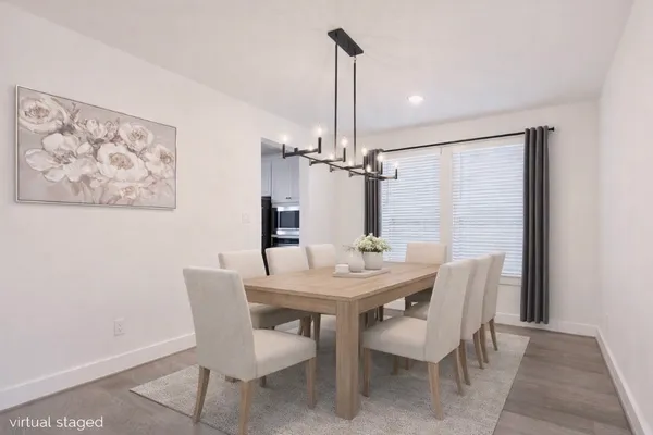a view of a dining room with furniture