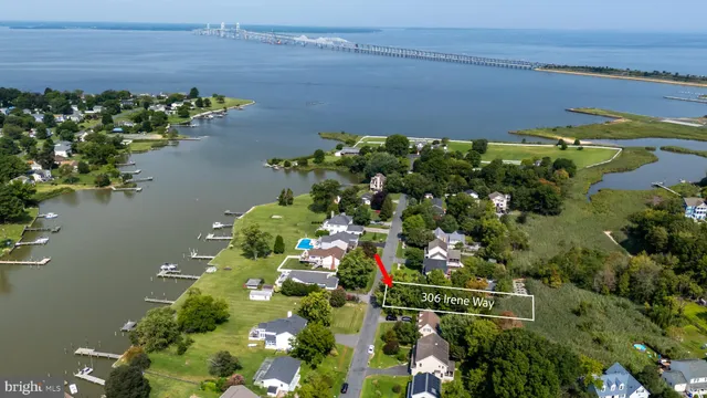 an aerial view of a houses with a lake view