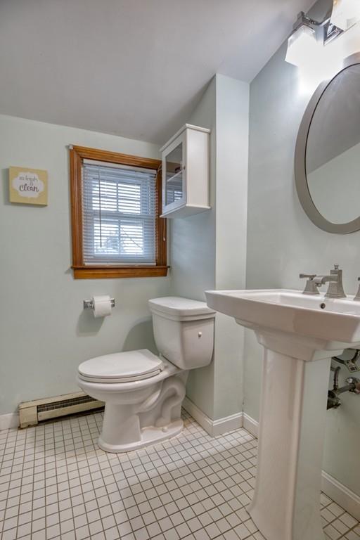 9 Laurel Road Braintree, MA 02184 - Photo 12 of 16 a bathroom with a sink toilet a mirror and tub