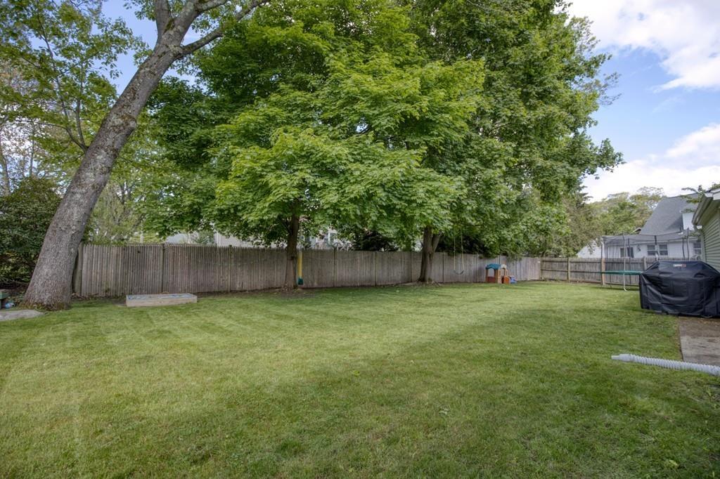 9 Laurel Road Braintree, MA 02184 - Photo 16 of 16 a view of a yard with a house and wooden fence