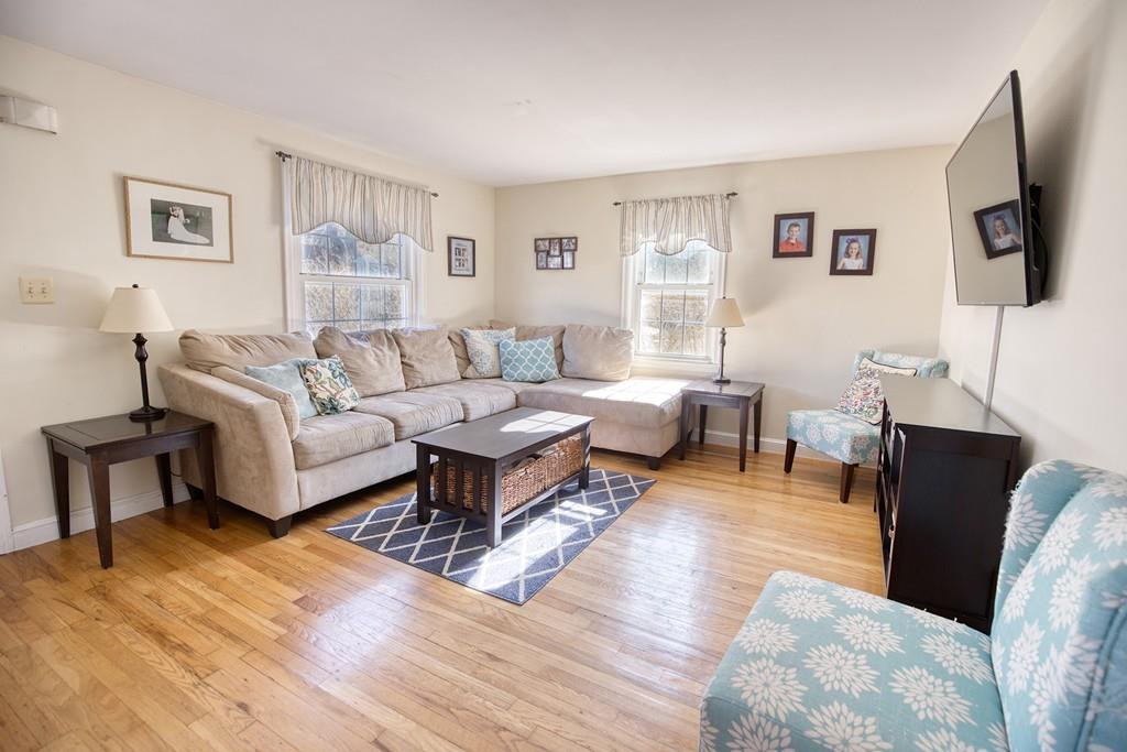 9 Laurel Road Braintree, MA 02184 - Photo 2 of 16 a living room with furniture a flat screen tv and a window