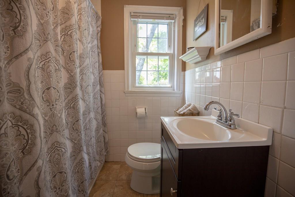 9 Laurel Road Braintree, MA 02184 - Photo 5 of 16 a bathroom with a sink and a toilet