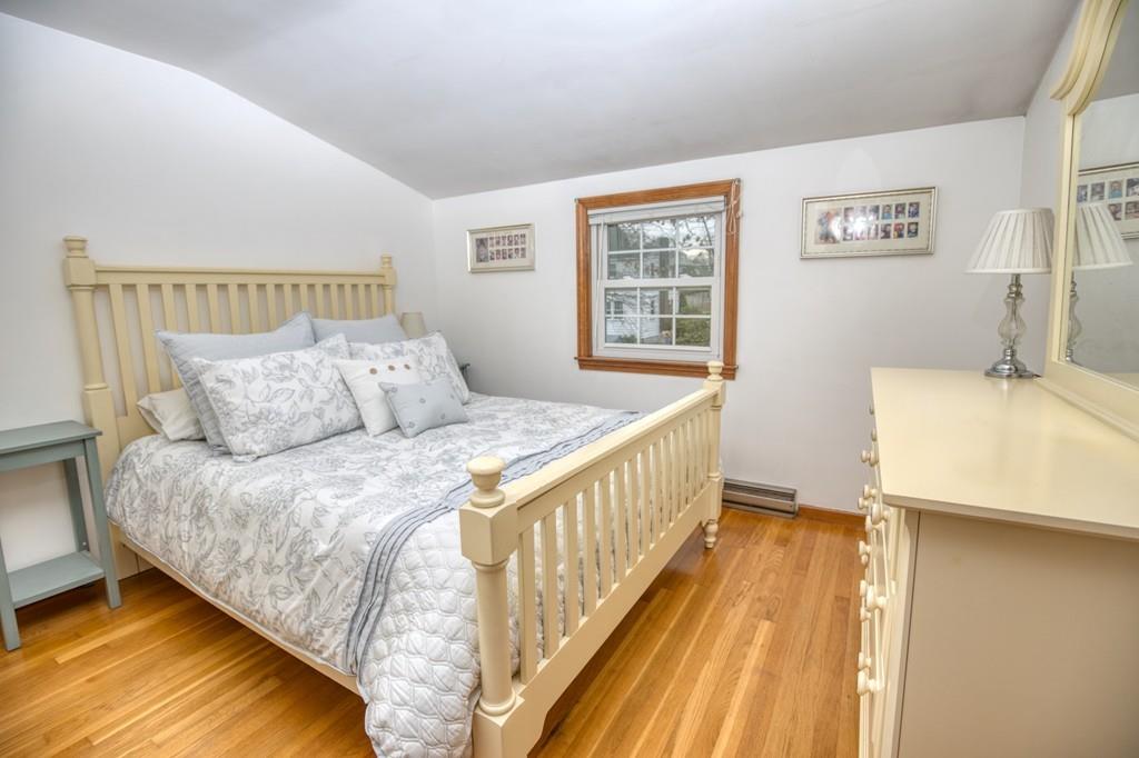 9 Laurel Road Braintree, MA 02184 - Photo 9 of 16 a bedroom with a bed and wooden floor