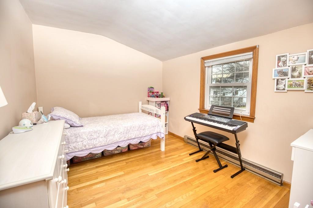 9 Laurel Road Braintree, MA 02184 - Photo 10 of 16 a bedroom with a bed and a window