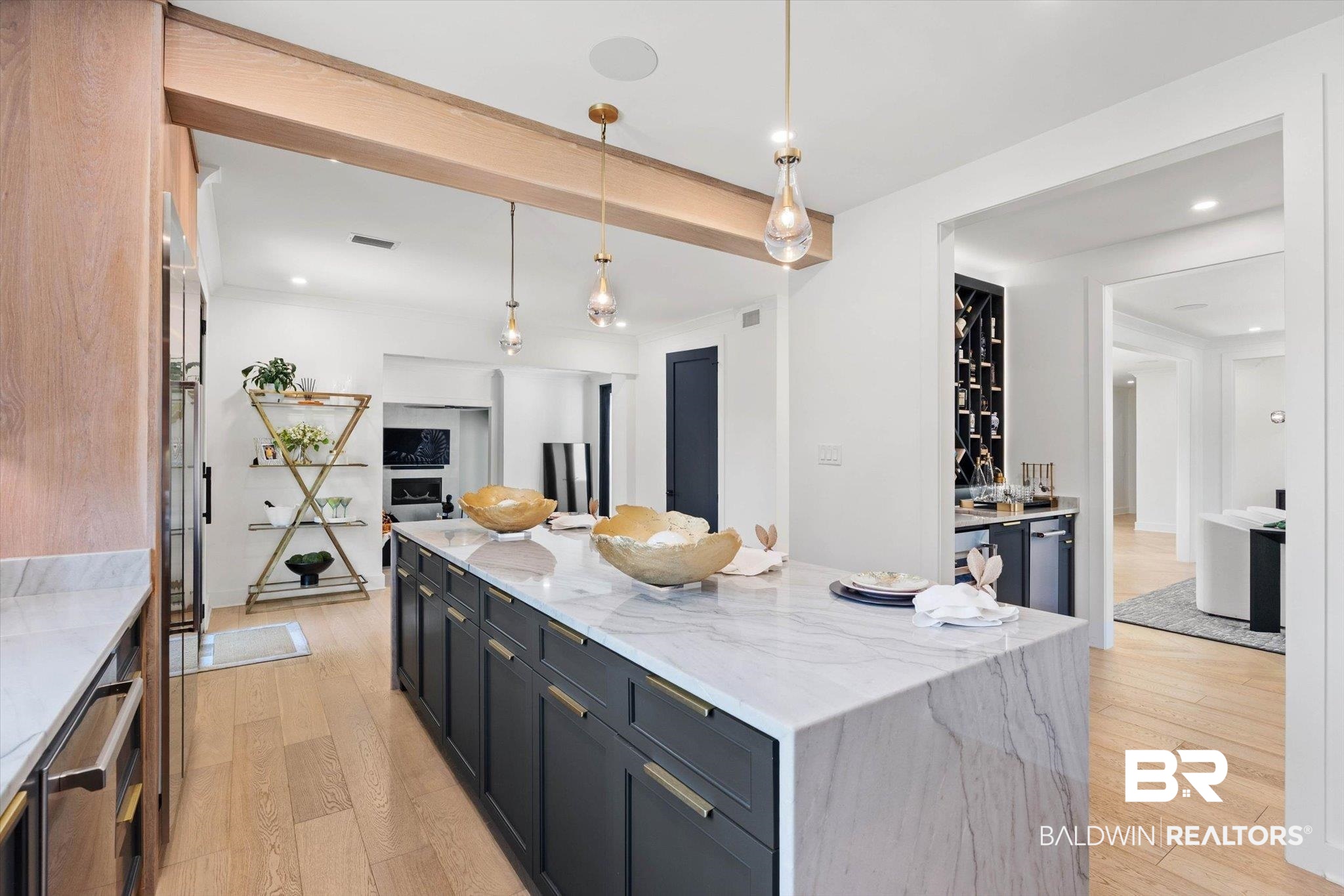 69 Jordan Lane Mobile, AL 36608 - Photo 9 of 57 Dual tone kitchen with light stone counters, light wood finished floors, pendant lighting, a center island, and stainless steel dishwasher