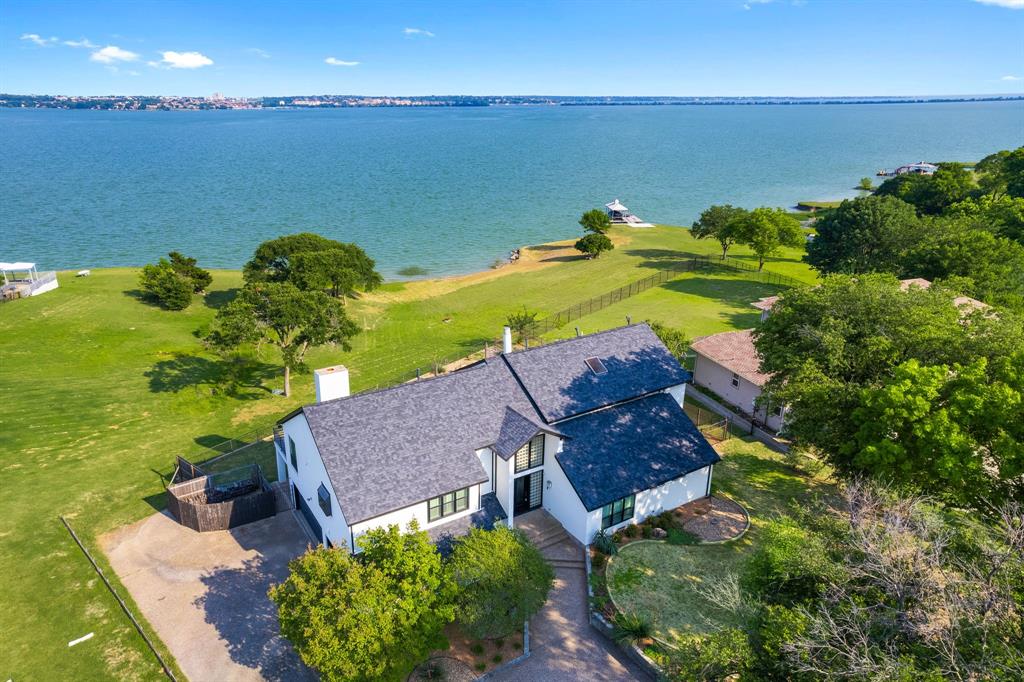 an aerial view of house with yard swimming pool and outdoor seating